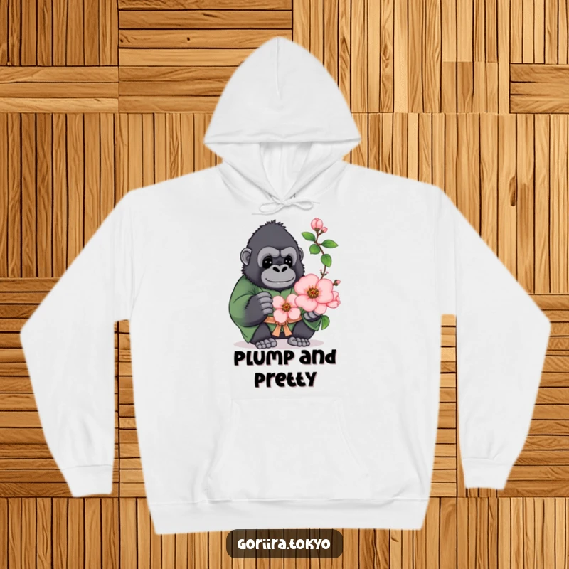 Funny hoodie design: a plump gorilla in a green kimono, offering a blooming peach blossom, exuding comfort and warmth.
