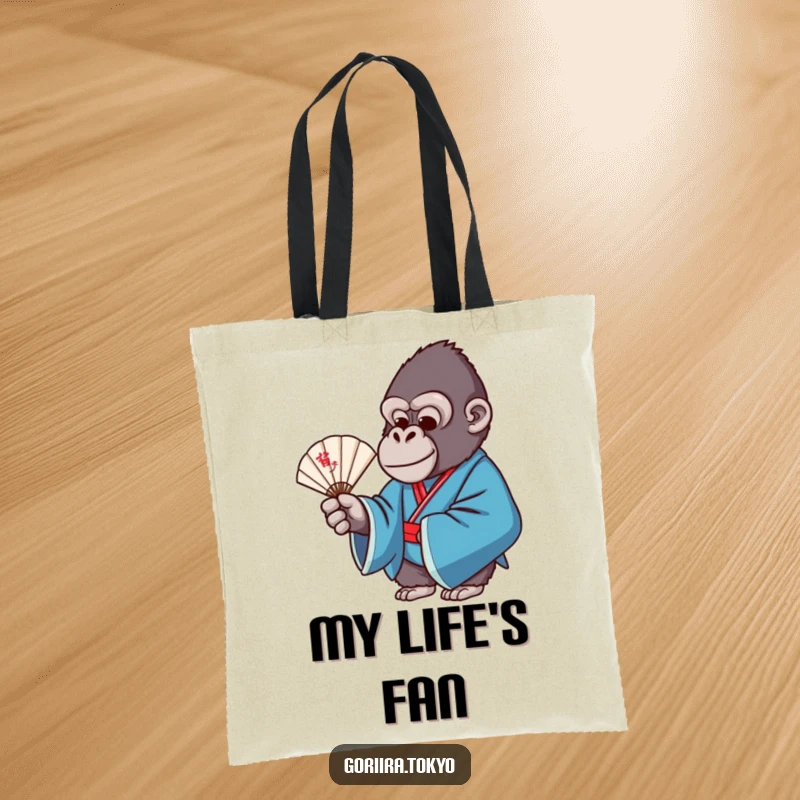 Funny tote bag featuring a gorilla in a blue formal kimono, gracefully holding a delicate fan, perfect for stylish carrying.